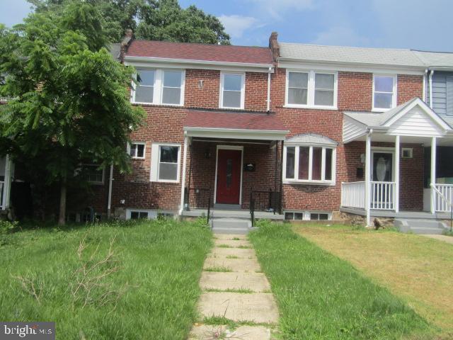 4223 Roland View Ave, Baltimore, MD 21215 - multi unit property featuring brick siding, covered porch, and a front yard
