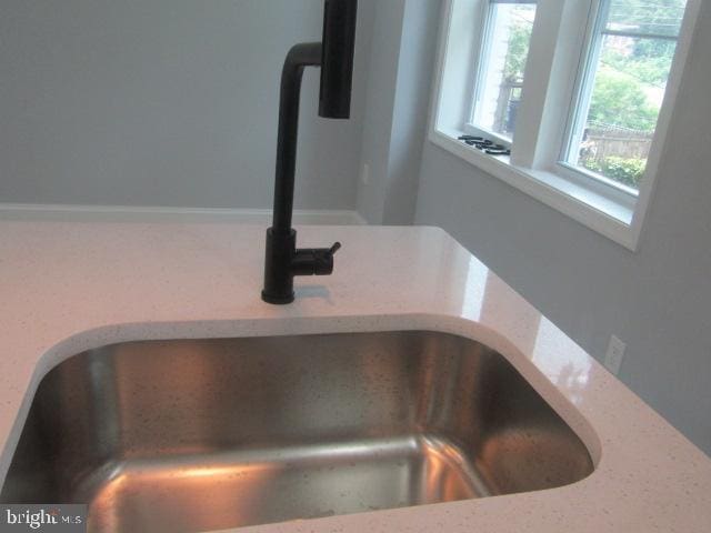 4223 Roland View Ave, Baltimore, MD 21215 - kitchen view of a sink and light stone countertops