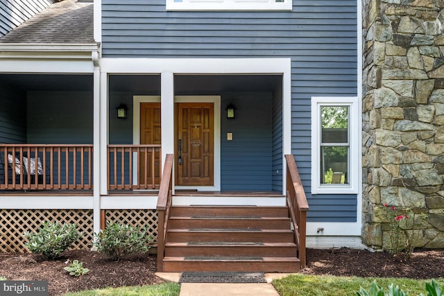 10309 E Hunter Valley Rd, Vienna, VA 22181 - entrance to property with stone siding, roof with shingles, and covered porch