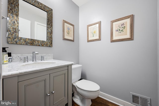 10309 E Hunter Valley Rd, Vienna, VA 22181 - half bathroom featuring vanity and wood finished floors