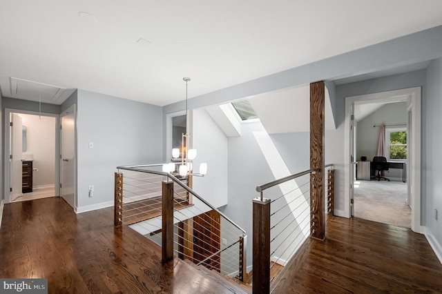 10309 E Hunter Valley Rd, Vienna, VA 22181 - hallway featuring an upstairs landing, attic access, wood finished floors, and a chandelier