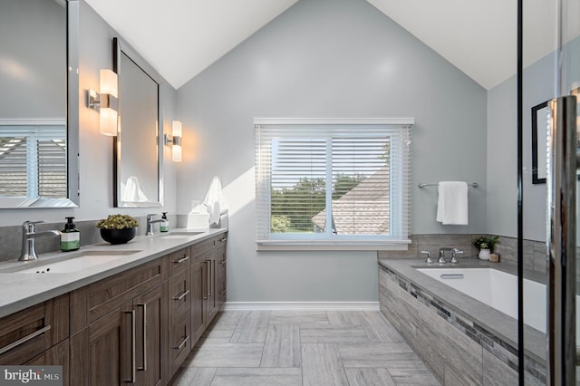 10309 E Hunter Valley Rd, Vienna, VA 22181 - full bath with lofted ceiling, double vanity, and a bath