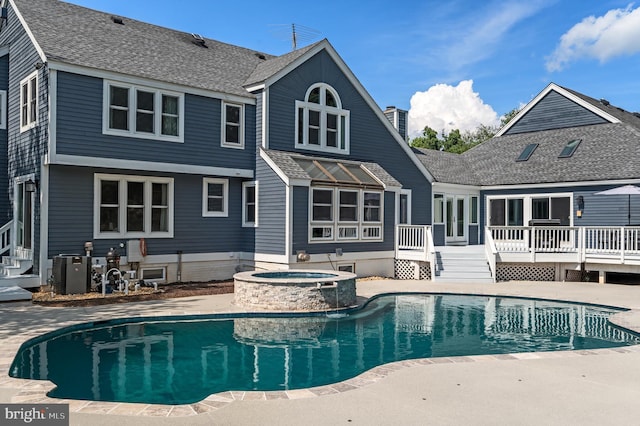 10309 E Hunter Valley Rd, Vienna, VA 22181 - view of swimming pool featuring a wooden deck, a pool with connected hot tub, and entry steps