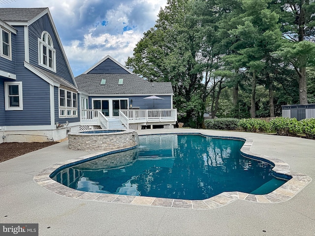 10309 E Hunter Valley Rd, Vienna, VA 22181 - view of swimming pool featuring a deck, a pool with connected hot tub, and a patio
