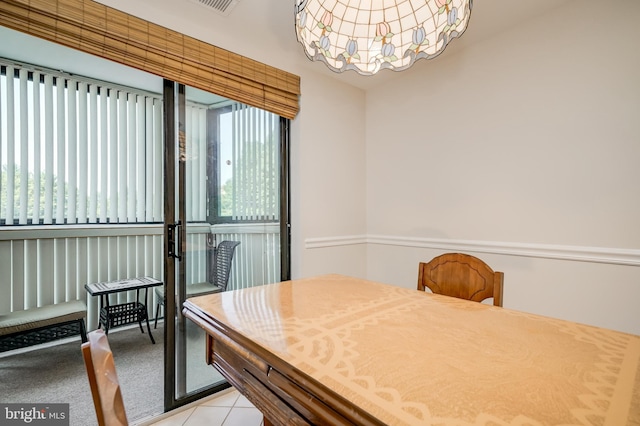 15100 Interlachen Dr Unit 4-207, Silver Spring, MD 20906 - dining space featuring healthy amount of natural light, a chandelier, and light tile patterned flooring