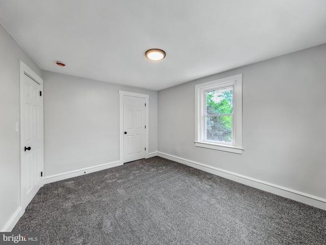 729 E Main St, Ephrata, PA 17522 - spare room featuring dark colored carpet and baseboards