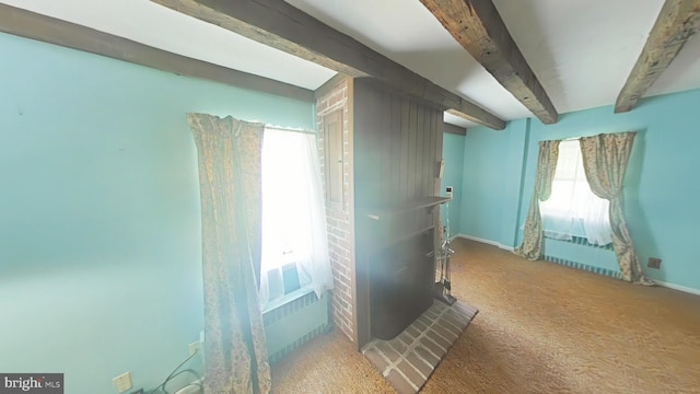 899 Shrivers Corner Rd, Gettysburg, PA 17325 - carpeted bedroom featuring beam ceiling and a wood stove