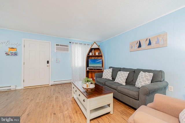 424 Lark Ln Unit E304, Ocean City, MD 21842 - living area with an AC wall unit, a baseboard radiator, light wood-style floors, and a textured ceiling