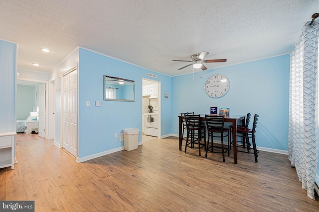 424 Lark Ln Unit E304, Ocean City, MD 21842 - dining area with a textured ceiling, ceiling fan, wood finished floors, and crown molding