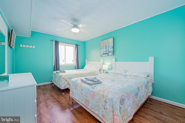 424 Lark Ln Unit E304, Ocean City, MD 21842 - bedroom with a textured ceiling, wood finished floors, and ceiling fan