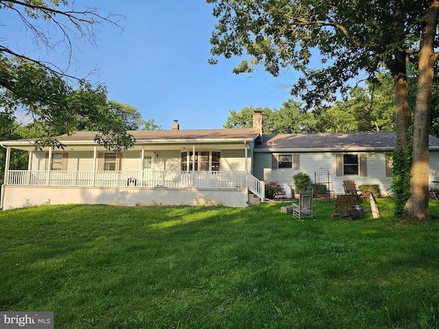 306 E Red Hill Rd, Conowingo, MD 21918 - back of property with a lawn, a porch, and a chimney