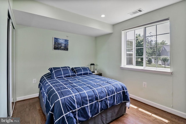 4195 S Four Mile Run Dr Unit 203, Arlington, VA 22204 - bedroom with wood finished floors and recessed lighting