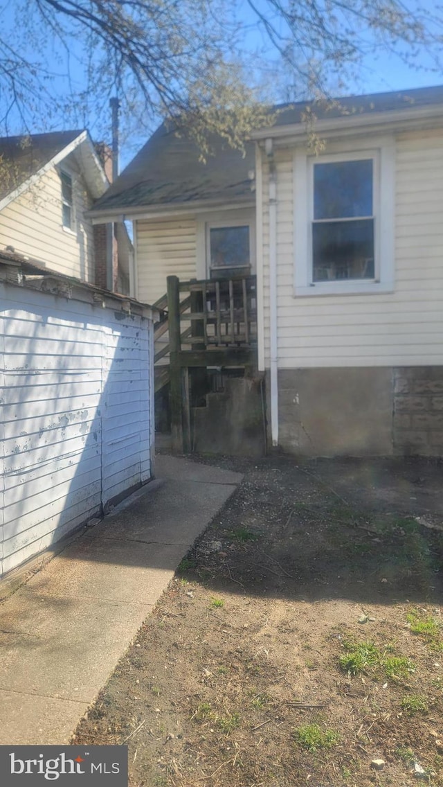 1324 S St SE, Washington, DC 20020 - view of side of property with a wooden deck and a storage unit