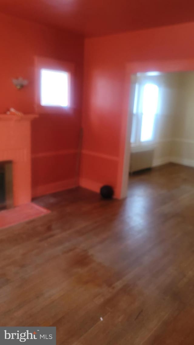 1324 S St SE, Washington, DC 20020 - unfurnished living room with a fireplace and wood finished floors