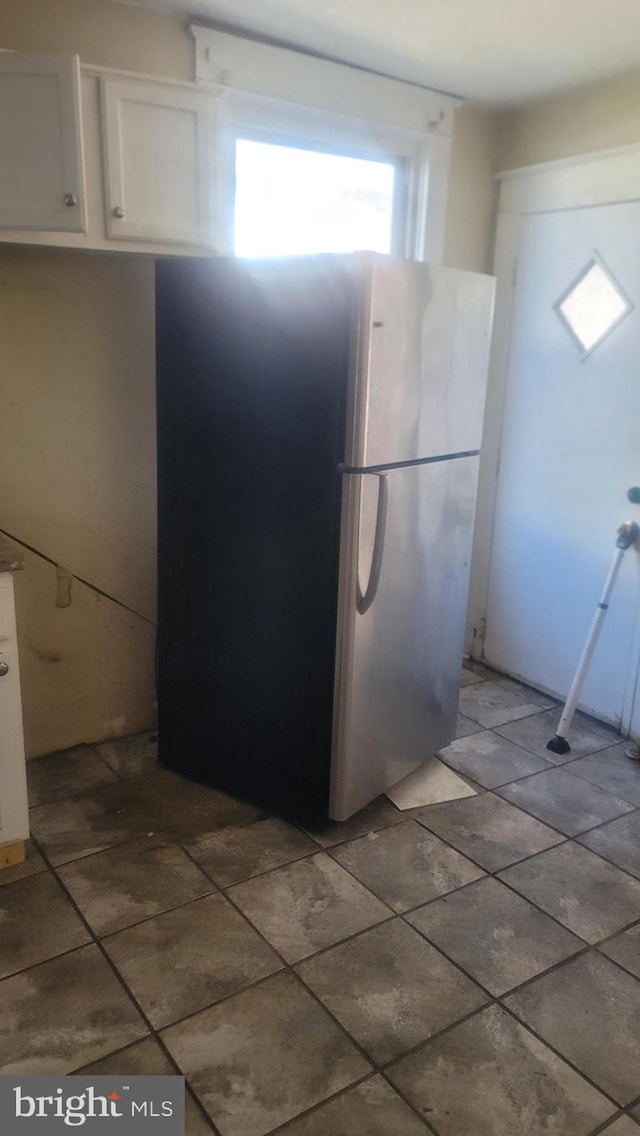 1324 S St SE, Washington, DC 20020 - kitchen with freestanding refrigerator and white cabinetry