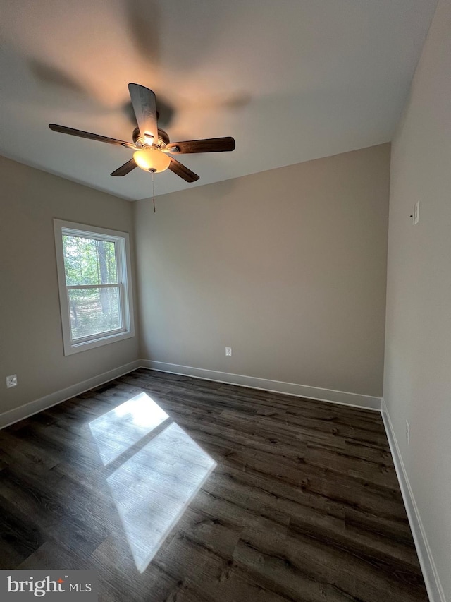 982 Mattox Ave, Colonial Beach, VA 22443 - empty room with dark wood-style floors and a ceiling fan