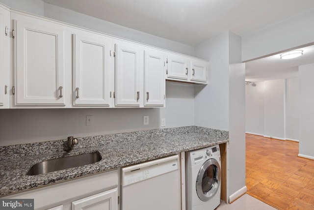 2939 Van Ness St NW Unit 230, Washington, DC 20008 - laundry room featuring washer / dryer and a sink