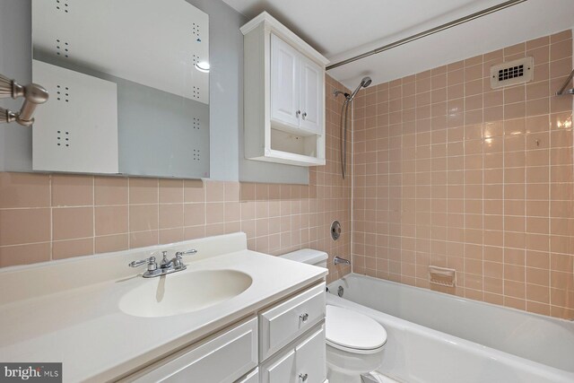 2939 Van Ness St NW Unit 230, Washington, DC 20008 - bathroom with shower / bathtub combination, vanity, tile walls, and decorative backsplash