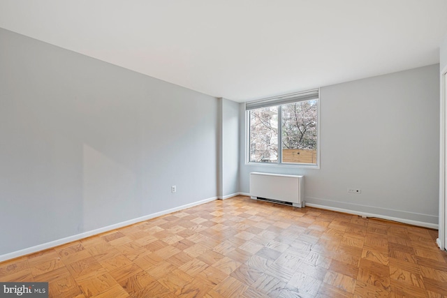 2939 Van Ness St NW Unit 230, Washington, DC 20008 - spare room featuring radiator heating unit and baseboards
