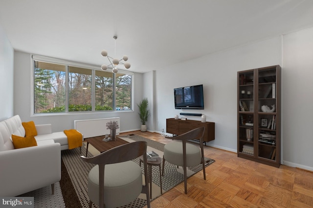 2939 Van Ness St NW Unit 230, Washington, DC 20008 - living area with a chandelier and baseboards