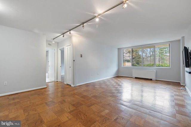 2939 Van Ness St NW Unit 230, Washington, DC 20008 - unfurnished room featuring rail lighting and radiator heating unit