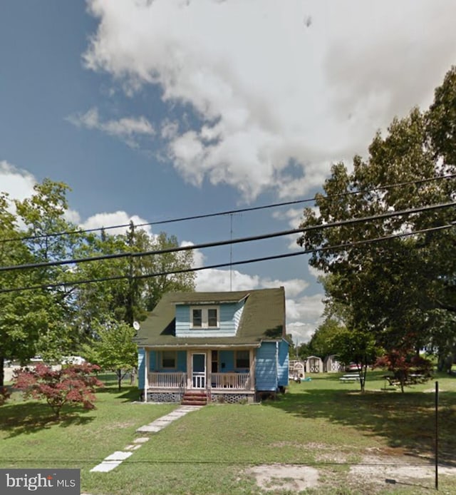 597 N Laurel St, Bridgeton, NJ 08302 - bungalow-style house featuring a porch and a front yard