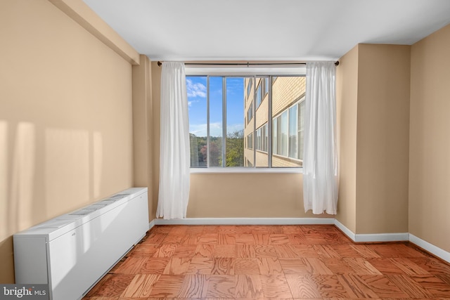 6641 Wakefield Dr Unit 405, Alexandria, VA 22307 - spare room featuring radiator heating unit and baseboards