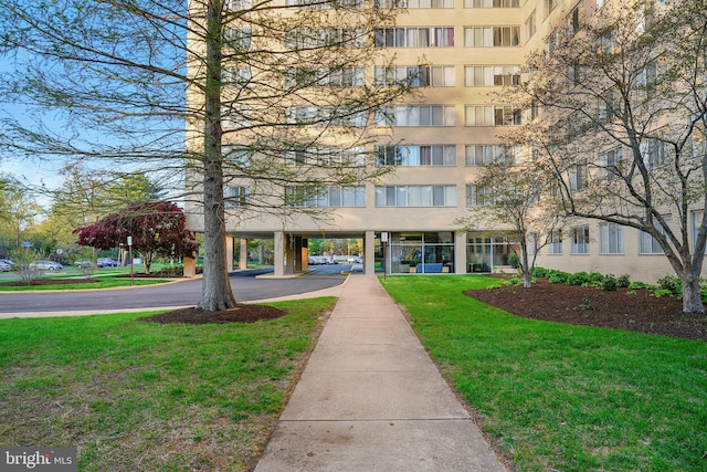 6641 Wakefield Dr Unit 405, Alexandria, VA 22307 - view of building exterior featuring asphalt driveway and a carport