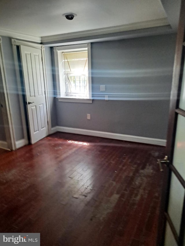 76 Galveston Pl SW Unit E, Washington, DC 20032 - unfurnished bedroom with dark wood-style floors and a closet