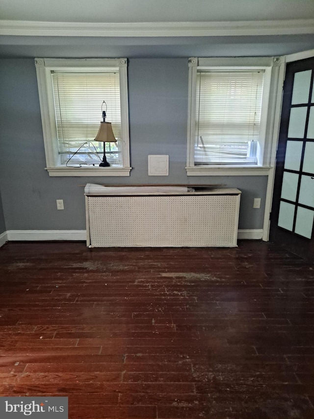 76 Galveston Pl SW Unit E, Washington, DC 20032 - spare room with radiator heating unit, plenty of natural light, wood-type flooring, and crown molding