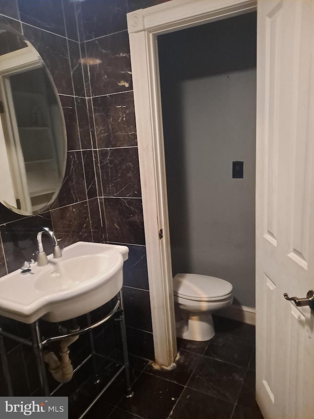 76 Galveston Pl SW Unit E, Washington, DC 20032 - half bath featuring toilet and tile patterned flooring