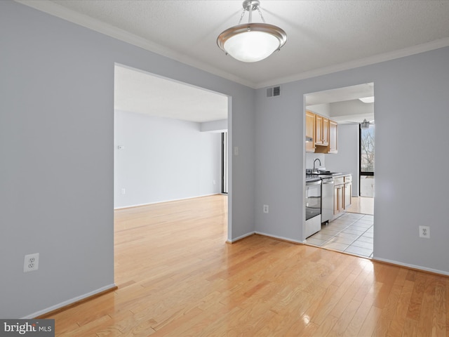 4500 S Four Mile Run Dr Unit 927, Arlington, VA 22204 - spare room featuring light wood-style flooring and ornamental molding