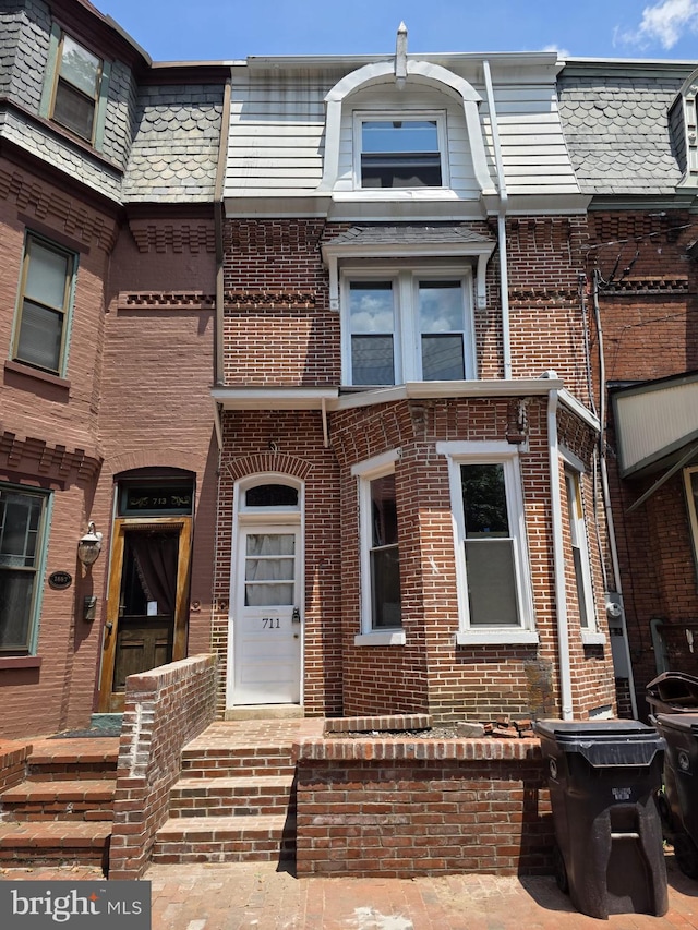 711 W Tenth St, Wilmington, DE 19801 - townhome / multi-family property with brick siding and mansard roof