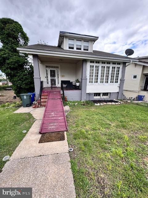 3203 Vickers Rd, Baltimore, MD 21216 - view of front of home featuring a front lawn and a porch