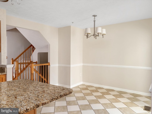 8730 Thornbrook Dr, Odenton, MD 21113 - unfurnished dining area featuring a chandelier and stairway