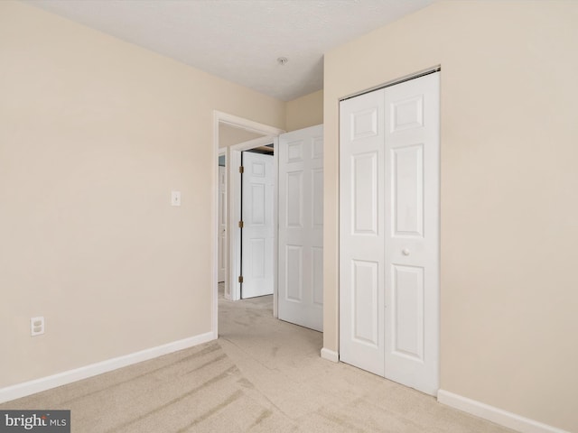 8730 Thornbrook Dr, Odenton, MD 21113 - unfurnished bedroom with light colored carpet and a closet