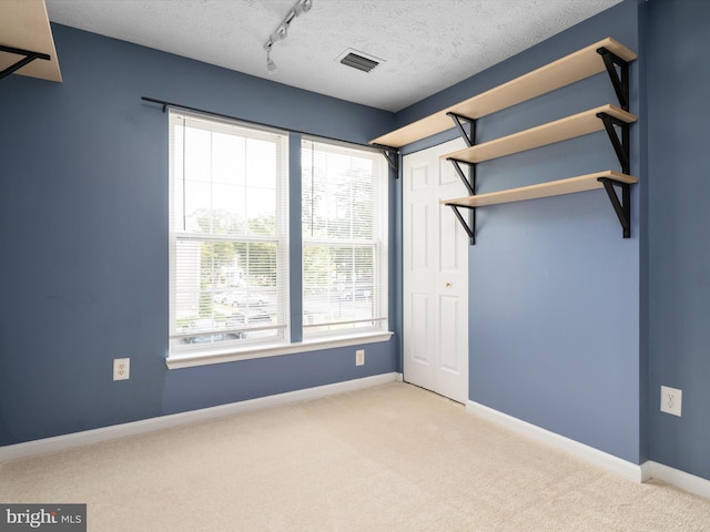 8730 Thornbrook Dr, Odenton, MD 21113 - unfurnished bedroom featuring carpet flooring, multiple windows, a closet, and a textured ceiling
