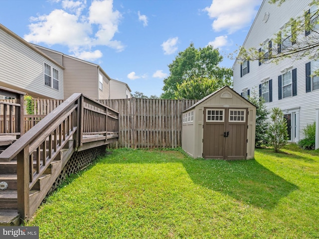 8730 Thornbrook Dr, Odenton, MD 21113 - view of yard featuring a storage unit and a wooden deck