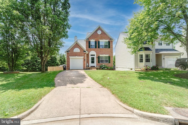 8 Ashley Ct, Stafford, VA 22554 - traditional-style home with brick siding, driveway, a front lawn, and a garage
