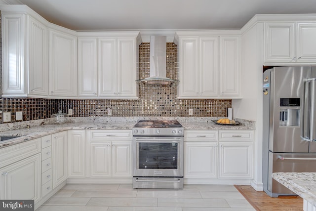 8 Ashley Ct, Stafford, VA 22554 - kitchen with stainless steel appliances, wall chimney exhaust hood, tasteful backsplash, and white cabinetry
