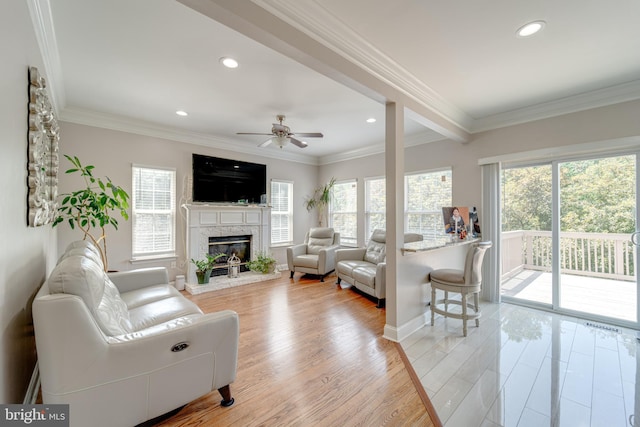 8 Ashley Ct, Stafford, VA 22554 - living area with healthy amount of natural light, a ceiling fan, recessed lighting, light wood-style floors, and a glass covered fireplace