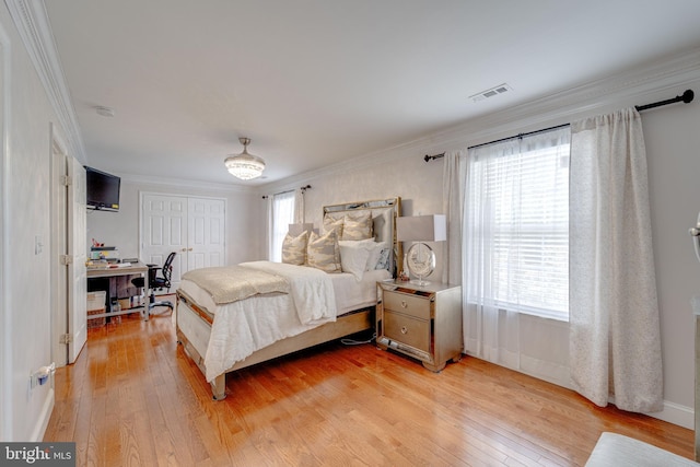 8 Ashley Ct, Stafford, VA 22554 - bedroom with light wood-style flooring, ornamental molding, a desk, and a closet