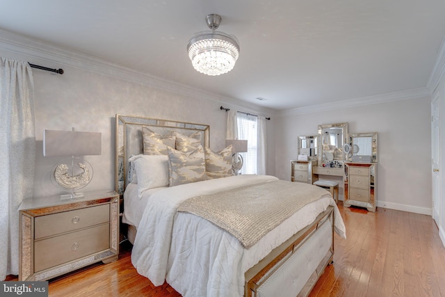 8 Ashley Ct, Stafford, VA 22554 - bedroom featuring crown molding, a chandelier, and light wood-style flooring