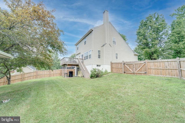 8 Ashley Ct, Stafford, VA 22554 - back of property with a fenced backyard, a wooden deck, a chimney, stairway, and a gate