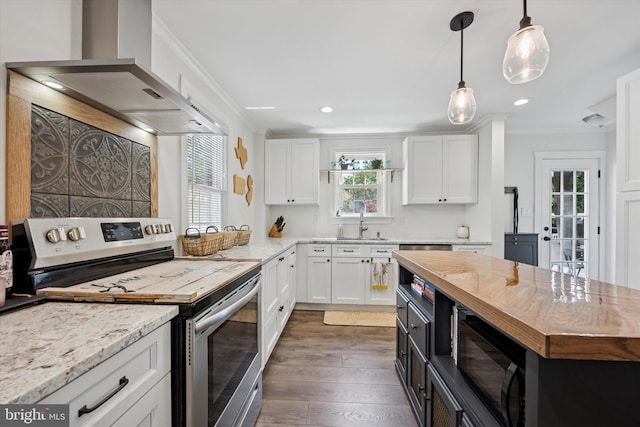 927 Drexel Ave, Drexel Hill, PA 19026 - kitchen with stainless steel range with electric stovetop, wall chimney exhaust hood, black microwave, white cabinets, and wood finished floors