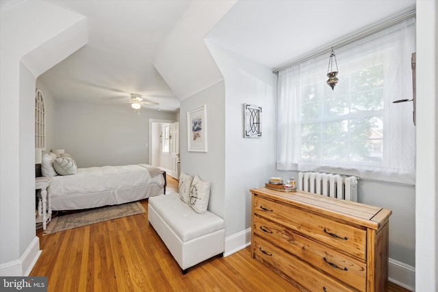 927 Drexel Ave, Drexel Hill, PA 19026 - bedroom featuring radiator heating unit, wood finished floors, and multiple windows