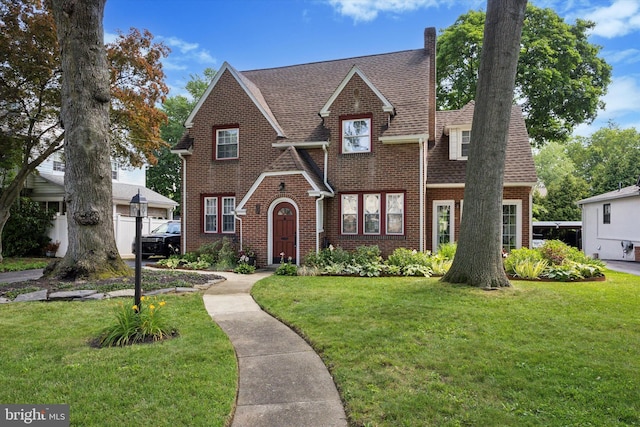 927 Drexel Ave, Drexel Hill, PA 19026 - view of front of property with brick siding, a front lawn, and a shingled roof