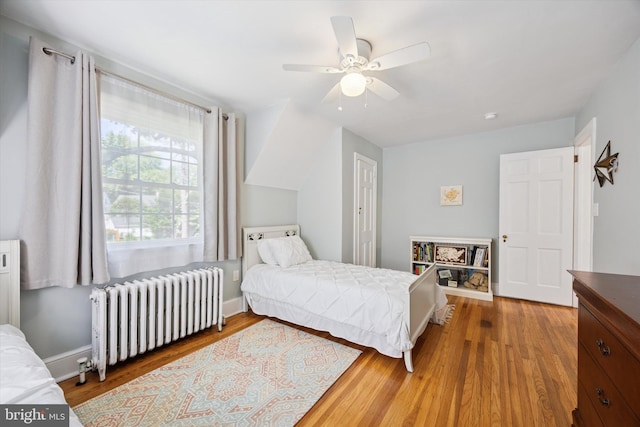 927 Drexel Ave, Drexel Hill, PA 19026 - bedroom featuring radiator heating unit, wood finished floors, and a ceiling fan