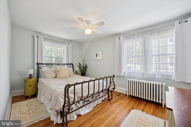 927 Drexel Ave, Drexel Hill, PA 19026 - bedroom with radiator, wood finished floors, and ceiling fan