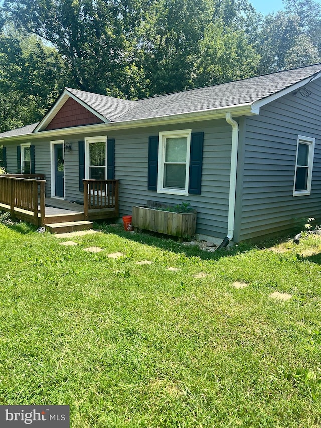 8 Ash Ln, Stafford, VA 22556 - view of front facade with a deck, roof with shingles, and a front lawn